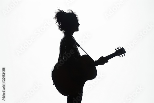 Silhouette of a Woman Playing Guitar