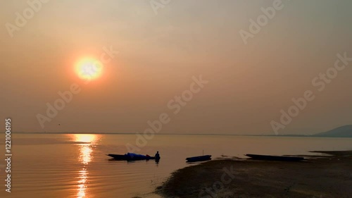 Fisherman on boat river sunset - Asia fisherman net using on wooden boat casting net sunset or sunrise in the Mekong river