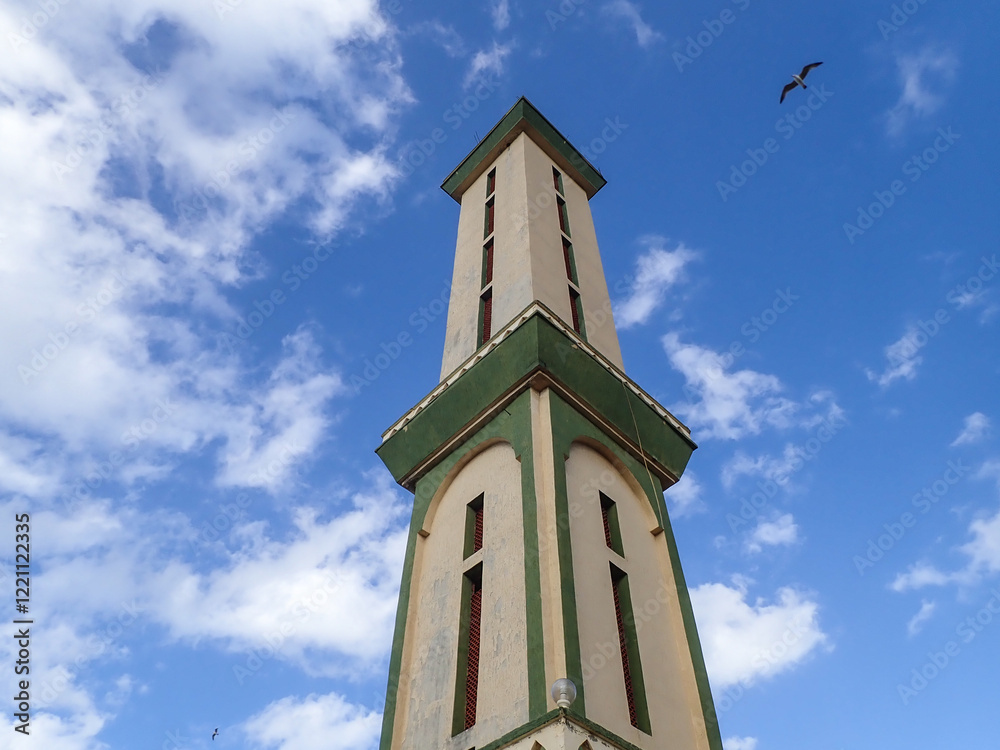 Muslim mosque for prayer and worship of Allah, Omar bin Abdul Aziz Mosque, Jijel State, Algeria, North African mosques in village on Mediterranean coast, Minaret and dome of mosque, Ramadan iftar. Muslim mosque for prayer and worship of Allah, Omar bin Abdul Aziz Mosque, Jijel State, Algeria, North African mosques in village on Mediterranean coast, Minaret and dome of mosque, Ramadan iftar.