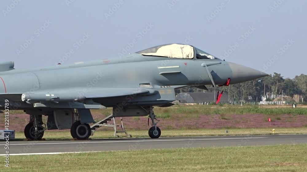 military fighter jet from air force parked airbase covered up waiting for missions combat operational close panning shot closeup operations aviation aircraft military fighter jet from air force parked airbase covered up waiting for missions combat operational close panning shot closeup operations aviation aircraft