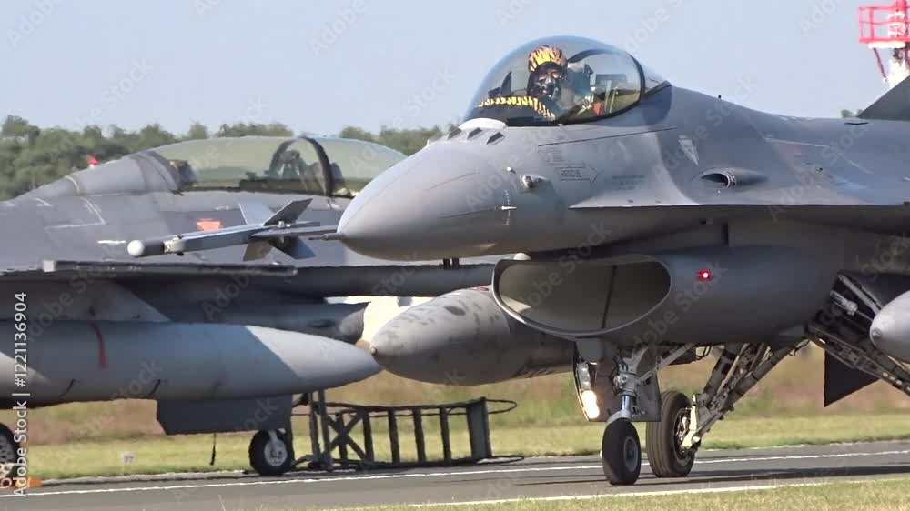 fighter jet seen taxiing airbase taxiway moving towards runway while preparing for combat mission pilot be saluting professionalism close up ready war military operation action aviation fighter jet seen taxiing airbase taxiway moving towards runway while preparing for combat mission pilot be saluting professionalism close up ready war military operation action aviation