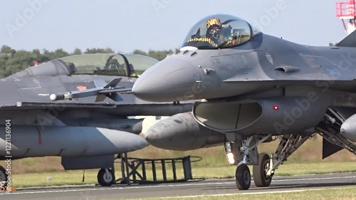 fighter jet seen taxiing airbase taxiway moving towards runway while preparing for combat mission pilot be saluting professionalism close up ready war military operation action aviation 