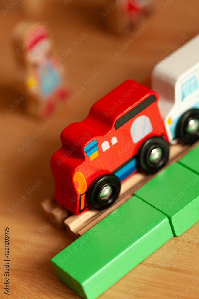 Colorful wooden toy train on a track with other toys. Perfect for educational play and imaginative fun! Colorful wooden toy train on a track with other toys. Perfect for educational play and imaginative fun!