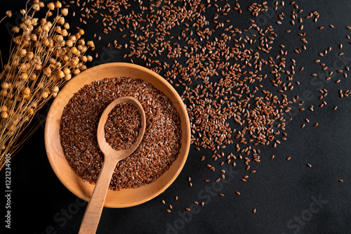 Healthy food. Healthy grains. Flax seeds in a wooden plate