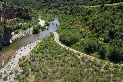 Viewed from the village of Minerve, the Cesse river is crossed by a footpath (Hérault, Occitanie, France) photo