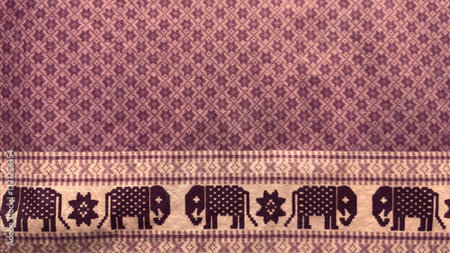 A purple fabric with elephants on it photo