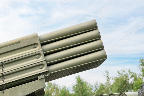 Multiple launch rocket system barrels. sky background