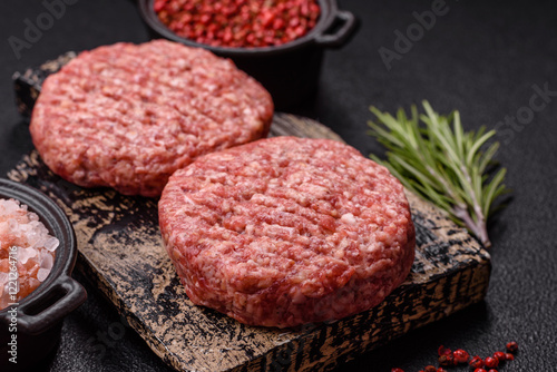 Bilde på lerret Fresh raw ground beef burger patty with salt and spices