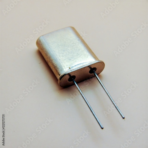 Close-up of the object. Electronic component: quartz resonator.