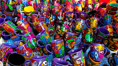 hand-painted ceramic coffee mugs and cups hand crafted by rural artisans from indian villages.  photo