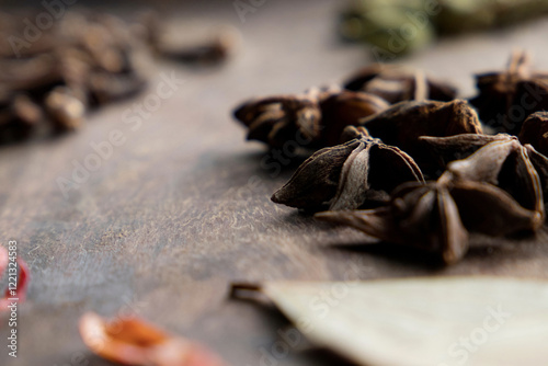 A mix of indian spices star anise, bay leaves and mace photo