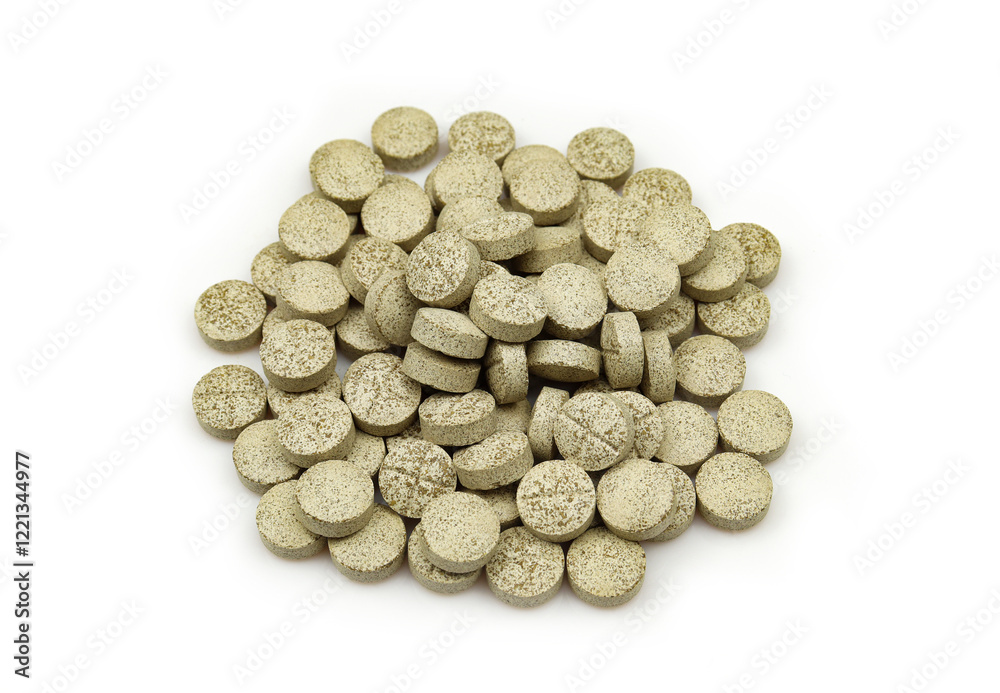 Pile of Ashwagandha pills isolated on white background. Natural organic tablets Pile of Ashwagandha pills isolated on white background. Natural organic tablets