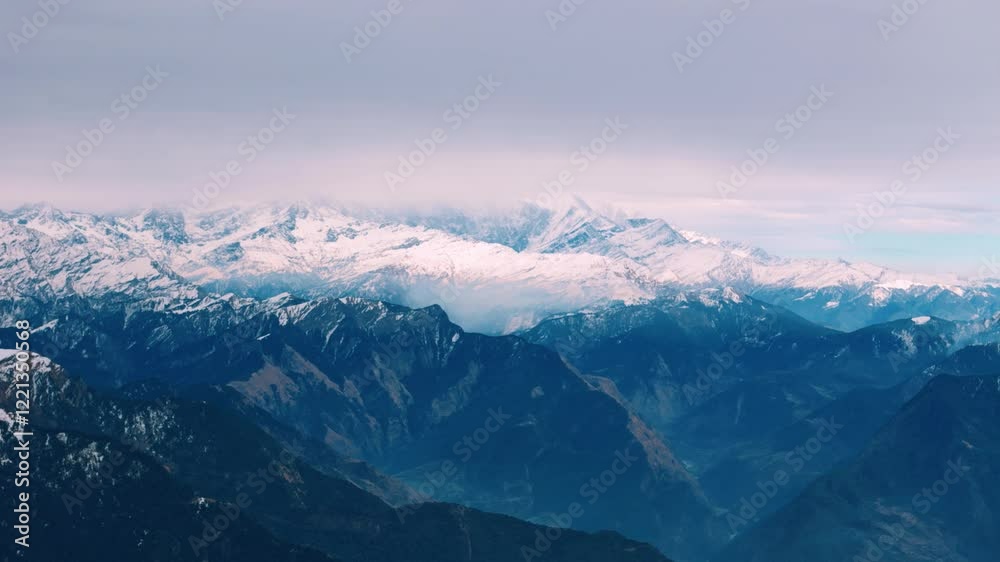 aerial shot of Nanda Devi peak covered in snow, highlighting the beauty of the Himalayas aerial shot of Nanda Devi peak covered in snow, highlighting the beauty of the Himalayas