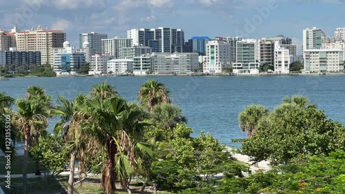 Downtown Sarasota Florida with Golden Gate Point from John Ringling Causeway bridge, yachts, palms and hotels, blue skies, skyscrapers and palms photo