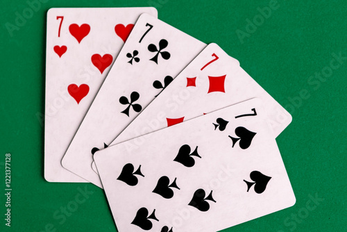 Poker quads playing card, green background photo