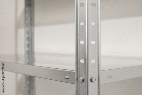 Empty stainless steel metal shelving unit with adjustable shelf for storage organization