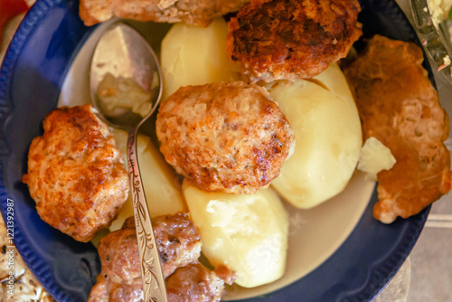Сutlets and potatoes in the plate, top view. Belarus traditional food