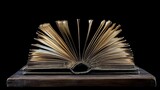 Open Antique Book with Gilded Pages on Wooden Surface with Black Background