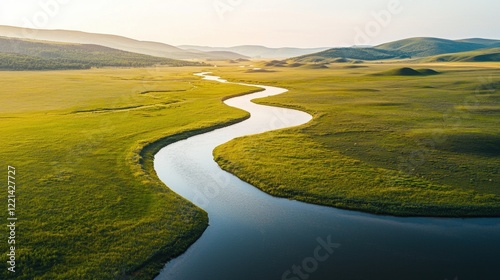 A long river runs through a grassy plain