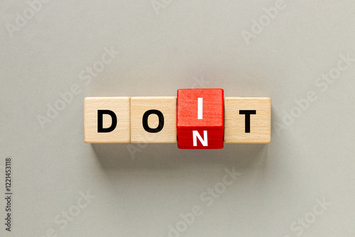 Wallpaper Mural Don't do and do it. Conceptual words, don't do changing do it. Text on wooden blocks. Beautiful Gray background. copy space. flat lay Torontodigital.ca