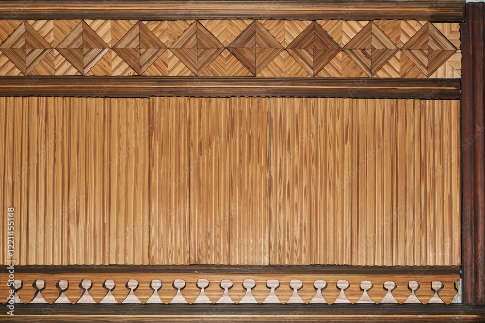 I decorated the hallway with wood in my apartment in 1990. A fragment of the wall decoration with wooden slats with a three-dimensional geometric pattern and natural wood texture in warm colors. I decorated the hallway with wood in my apartment in 1990. A fragment of the wall decoration with wooden slats with a three-dimensional geometric pattern and natural wood texture in warm colors.
