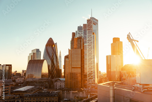 Photography Rooftop view looking over London City during sunset