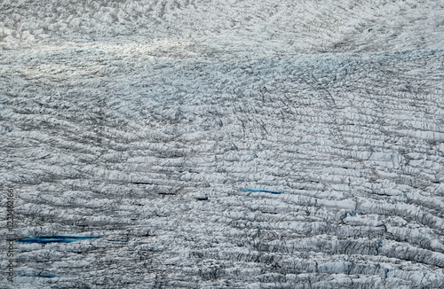 Over the Greenland Ice Sheet. Aerial view of the endless ice sheet to horizon. Concept of coldness and isolation photo