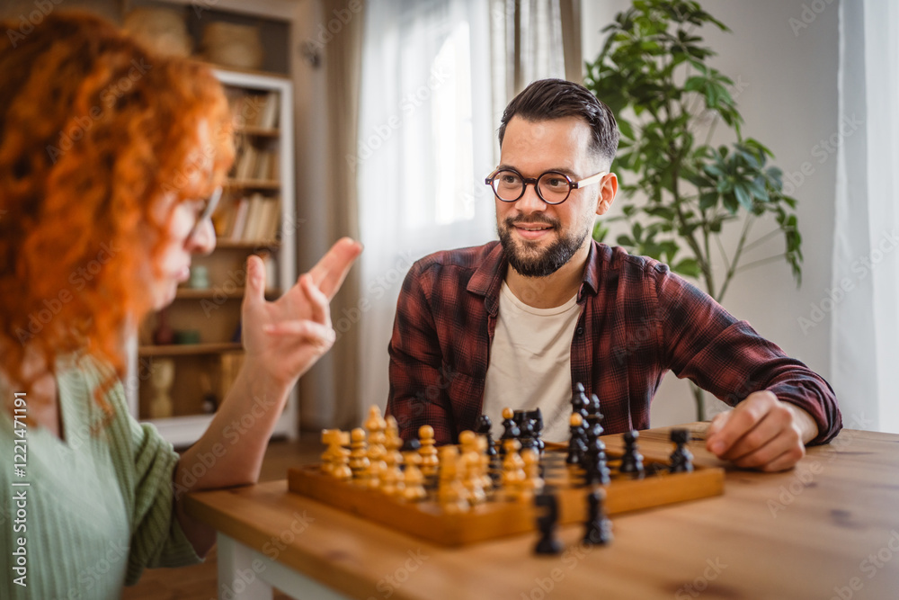 young couple in love enjoy and spend time together at home play chess