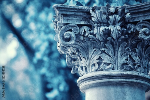 Intricate stone column capital with acanthus leaf carvings, showcasing classical architectural detail. photo