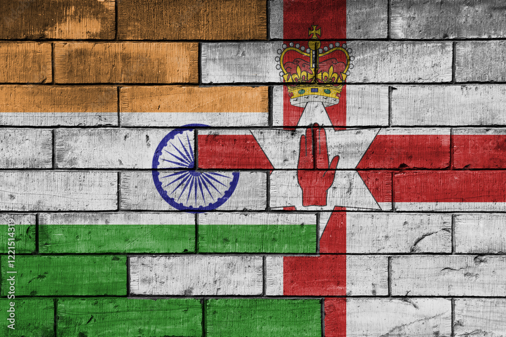 colourful painted big flag of india and flag of northern ireland on a massive old brick wall background. concept colourful painted big flag of india and flag of northern ireland on a massive old brick wall background. concept
