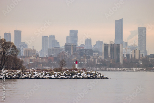 Photography Lighthouse on a jetty with Toronto city behind it in the background