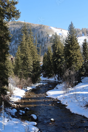 Snow covered Gore Creek in Vail, Colorado, USA.