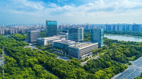 Modern Buildings Surrounded by Greenery With a Lake and City Skyline in the Background on a Clear Day