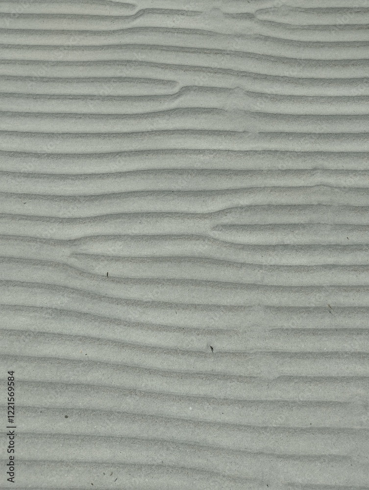 Fototapeta premium Sand and wave pattern on the beach 