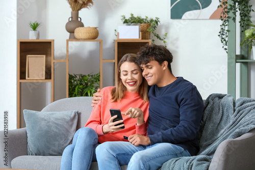 Young couple with mobile ph...