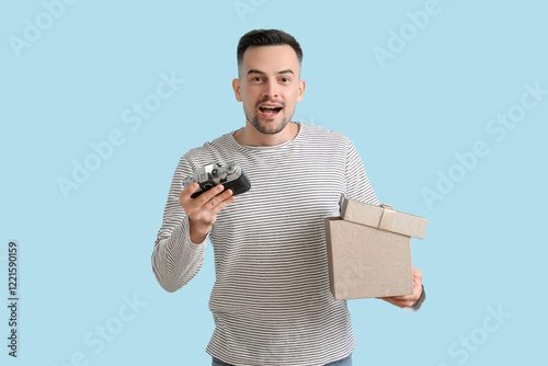 Happy young man with photo ...