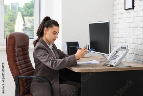 Female office worker doing ...
