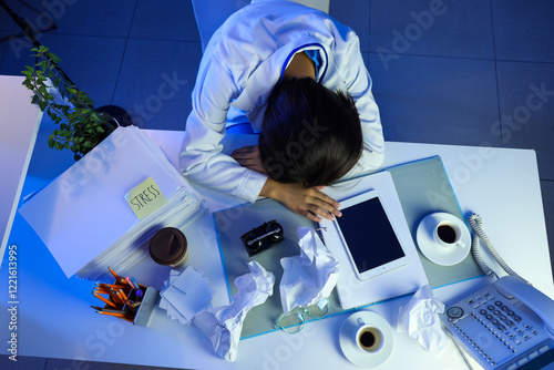 Tired female doctor sitting...