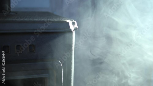 Dense white smoke billowing from malfunctioning cast iron stove, rapidly spreading across indoor space and creating dangerous household hazard with potential respiratory risks