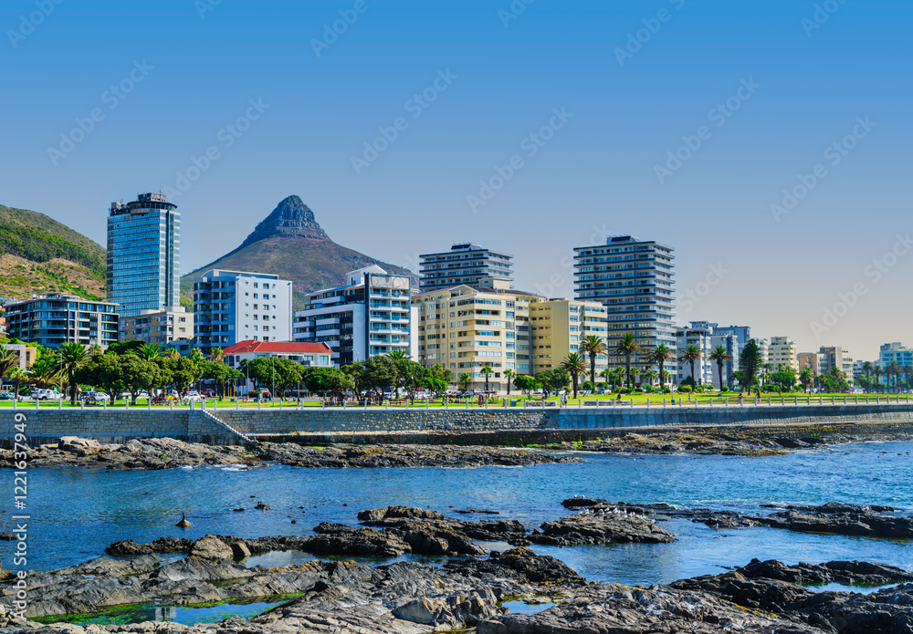 Sea Point view from the ocean with rocks and sparkling Atlantic Ocean, Cape Town, South Africa