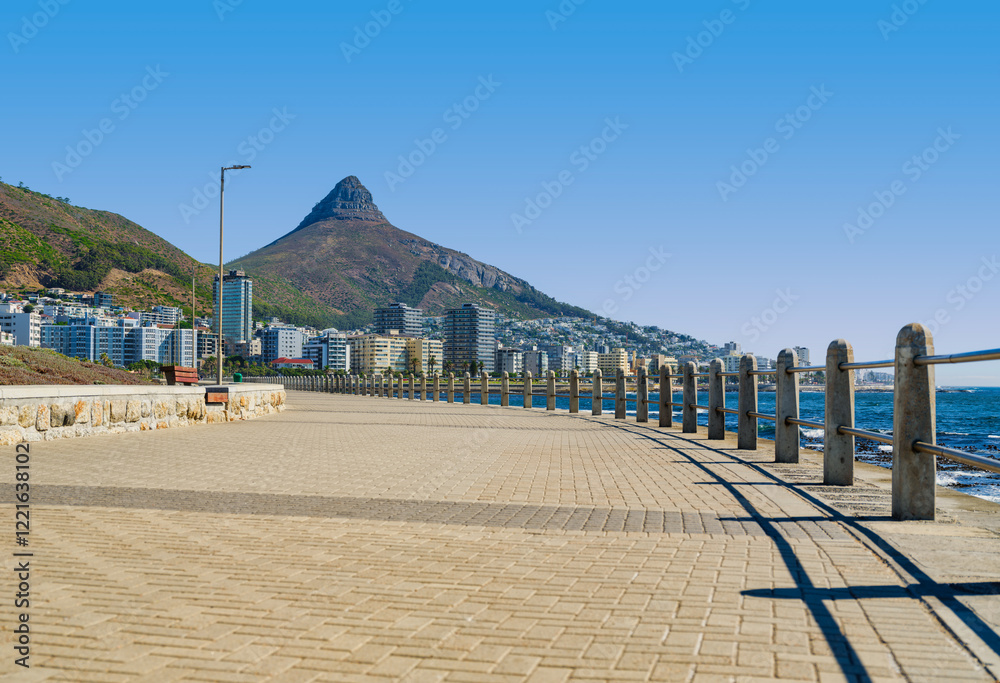 Lower angle shot of Sea Point Promenade with Lion's Head in the background, Cape Town, South Africa