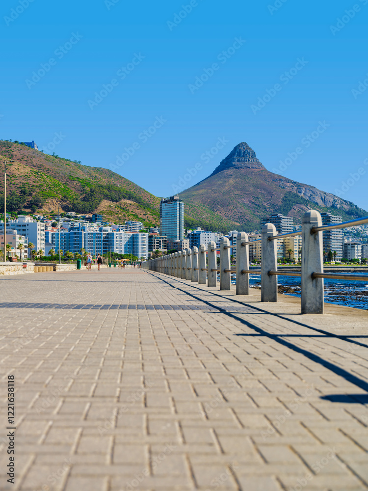 Vertical shot of Sea Point Promenade with Lion's Head in the background, Cape Town, South Africa