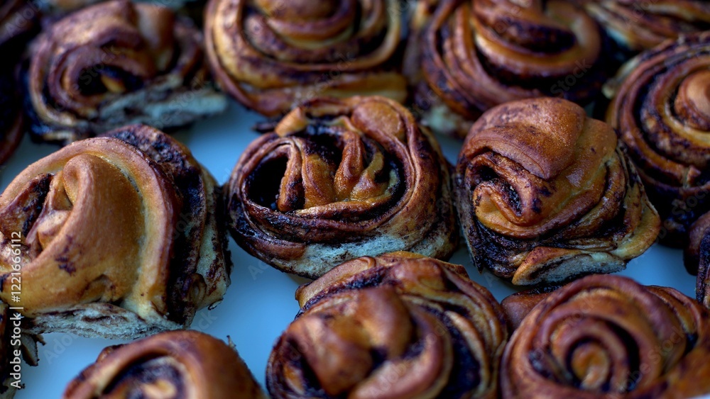 Fototapeta premium many cinnabons are lying on the counter