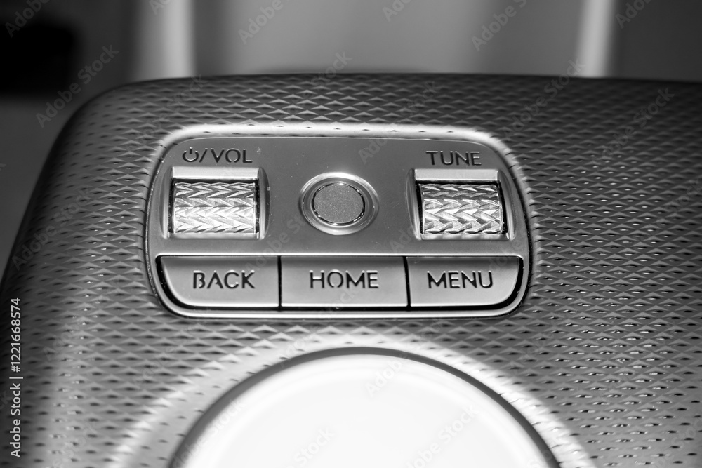 Fototapeta premium Close up view of volume and tune knobs on a luxury car console.