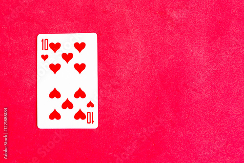 Ten of Hearts playing card on red background, top view, copy space photo