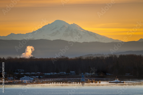 Canvas Print Ferry boat leaving the mainland for a run to the island during a beautiful sunrise over Mt