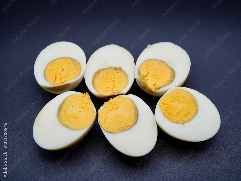 Boiled chicken egg slices isolated on a black background Boiled chicken egg slices isolated on a black background