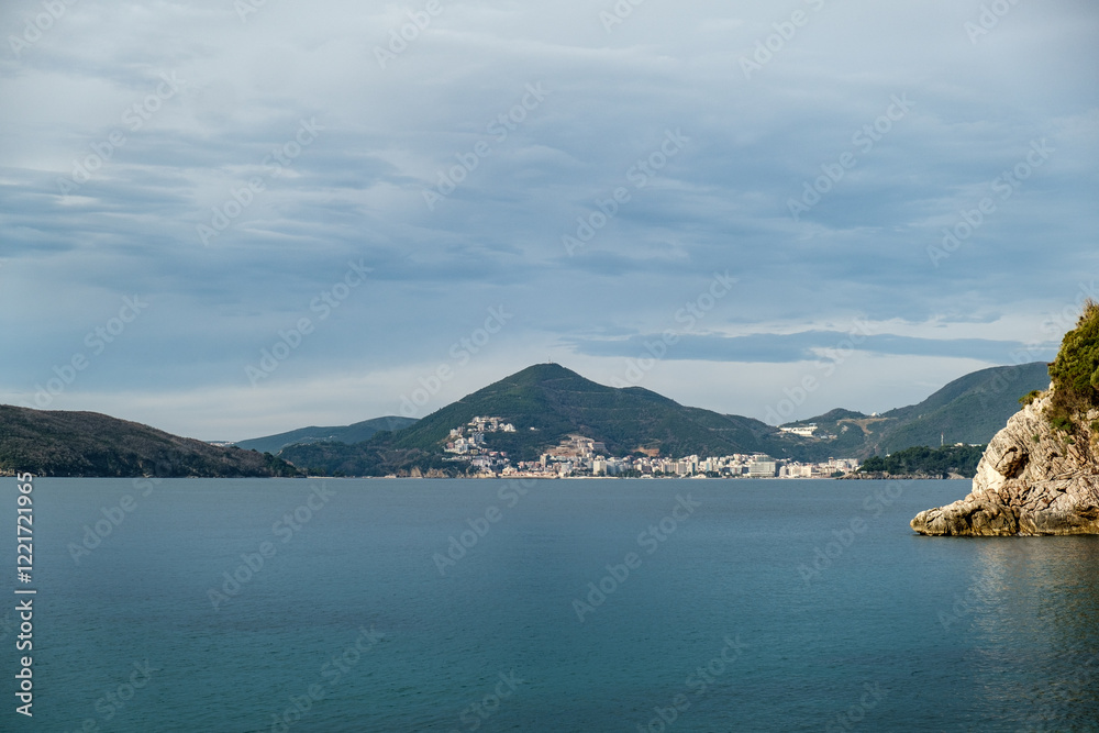 Scenic coastal view of Budva, Montenegro with mountains and the Adriatic Sea, beautiful seaside town Scenic coastal view of Budva, Montenegro with mountains and the Adriatic Sea, beautiful seaside town