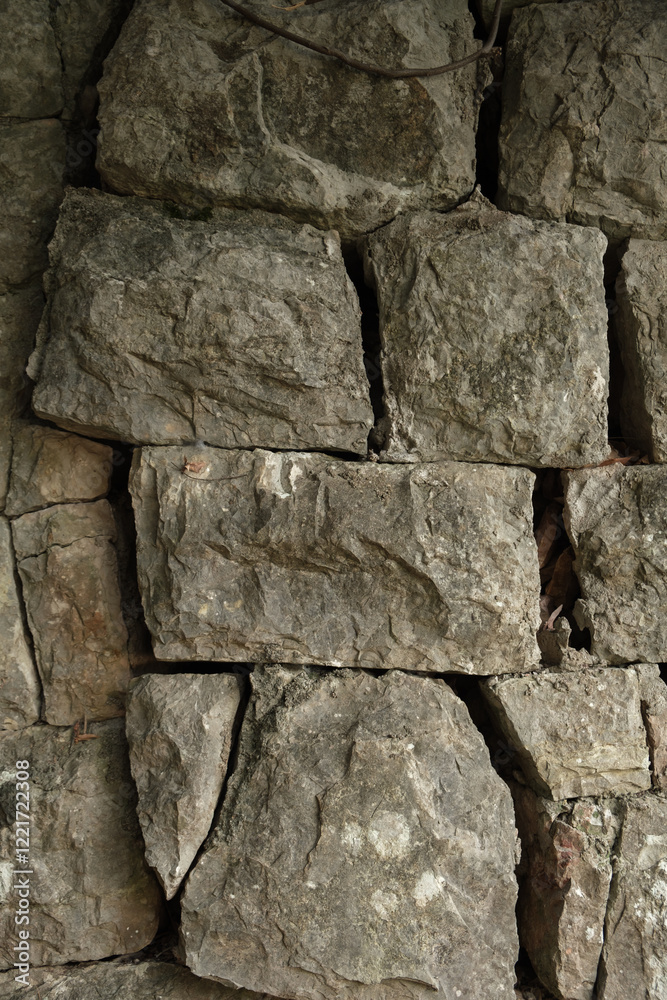 Fototapeta premium Rugged Stone Wall with Weathered Rocks 