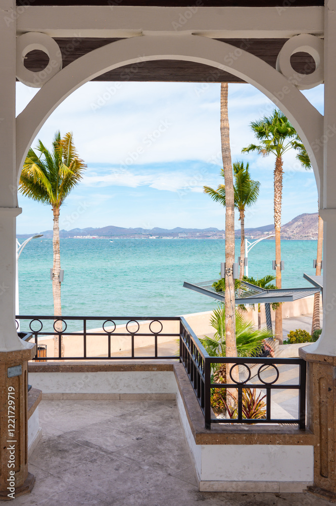Sunny Beach Holiday Scene in La Paz, Baja California Sur - Mexican Beaches with Palm Trees, Malecon and Boardwalk, sunshine and beach buildings Sunny Beach Holiday Scene in La Paz, Baja California Sur - Mexican Beaches with Palm Trees, Malecon and Boardwalk, sunshine and beach buildings